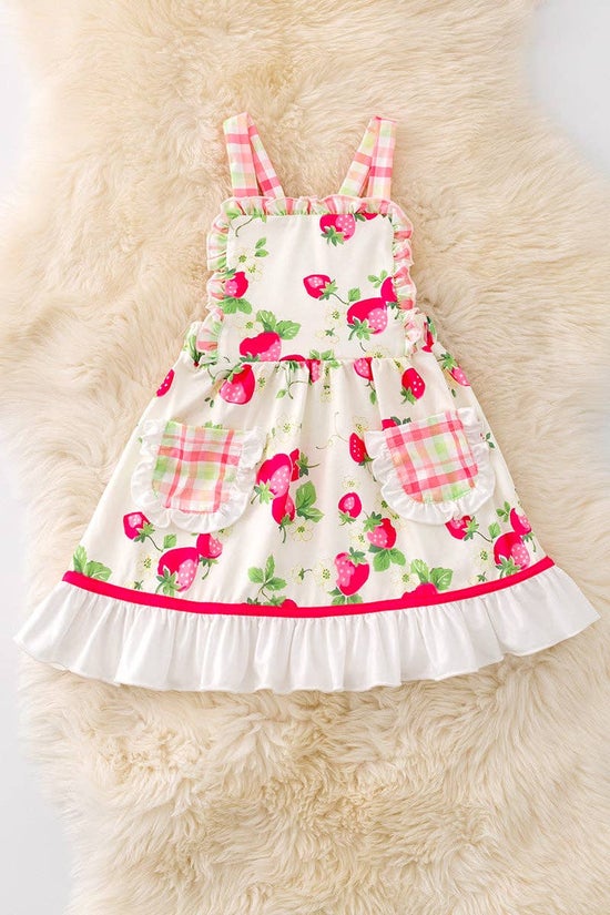 Strawberry printed dress with front pockets.