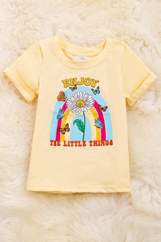 "Enjoy the little things" candle light color printed tee shirt with folded sleeves.