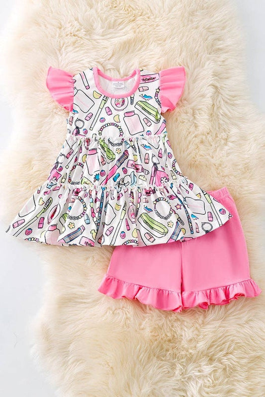 Multi-printed back to school tunic and pink ruffle shorts.