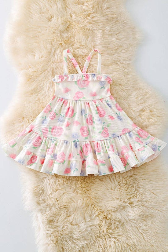 Pink rose printed girls dress with ruffle hem.