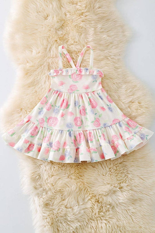 Pink rose printed girls dress with ruffle hem.